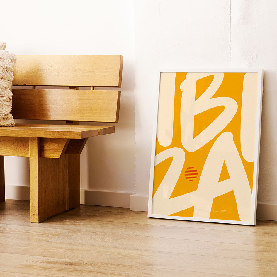 Framed Minimal style Ibiza typography print with the word Ibiza in rich, golden yellow and light sandy colours.