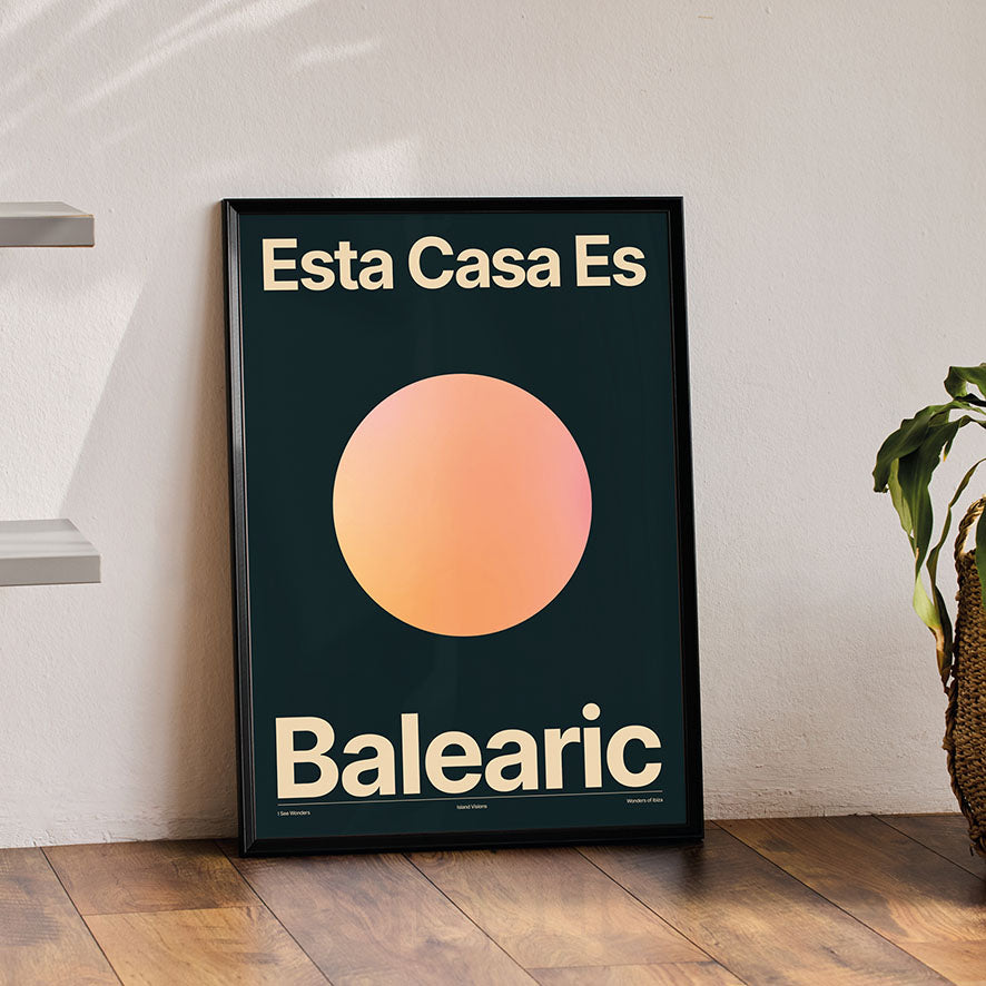 Framed Minimal style Ibiza typography art print which says Esta Casa Es Balearic / This House is Balearic in cream writing on a rich dark background with warm glowing sun.
