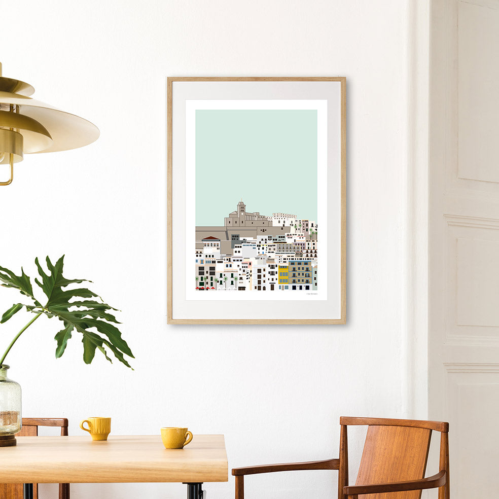 Framed Graphic design Ibiza art print of Dalt Vila, Ibiza with a turquoise sky behind. 