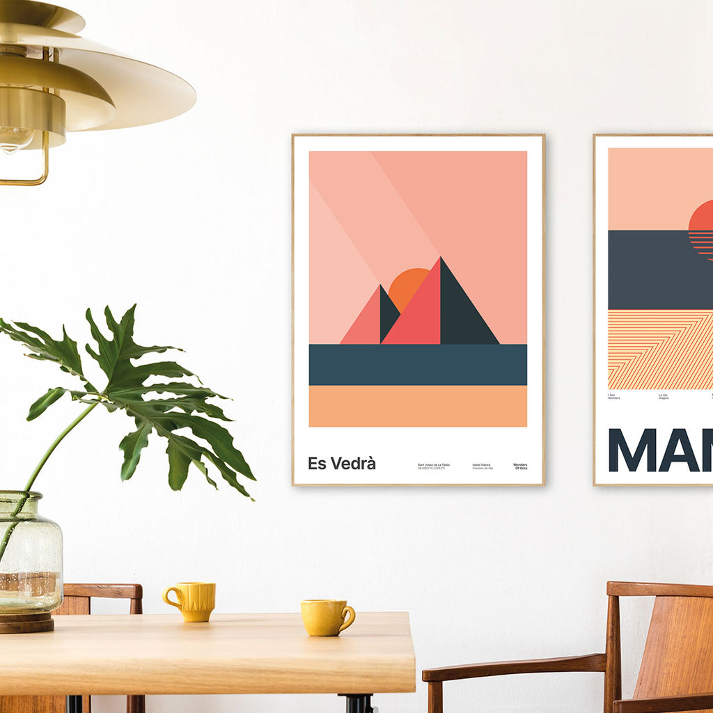 Framed Minimal style graphic design Ibiza art print of Es Vedra, Ibiza represented as pink pyramids with golden sand on a light pink sky background