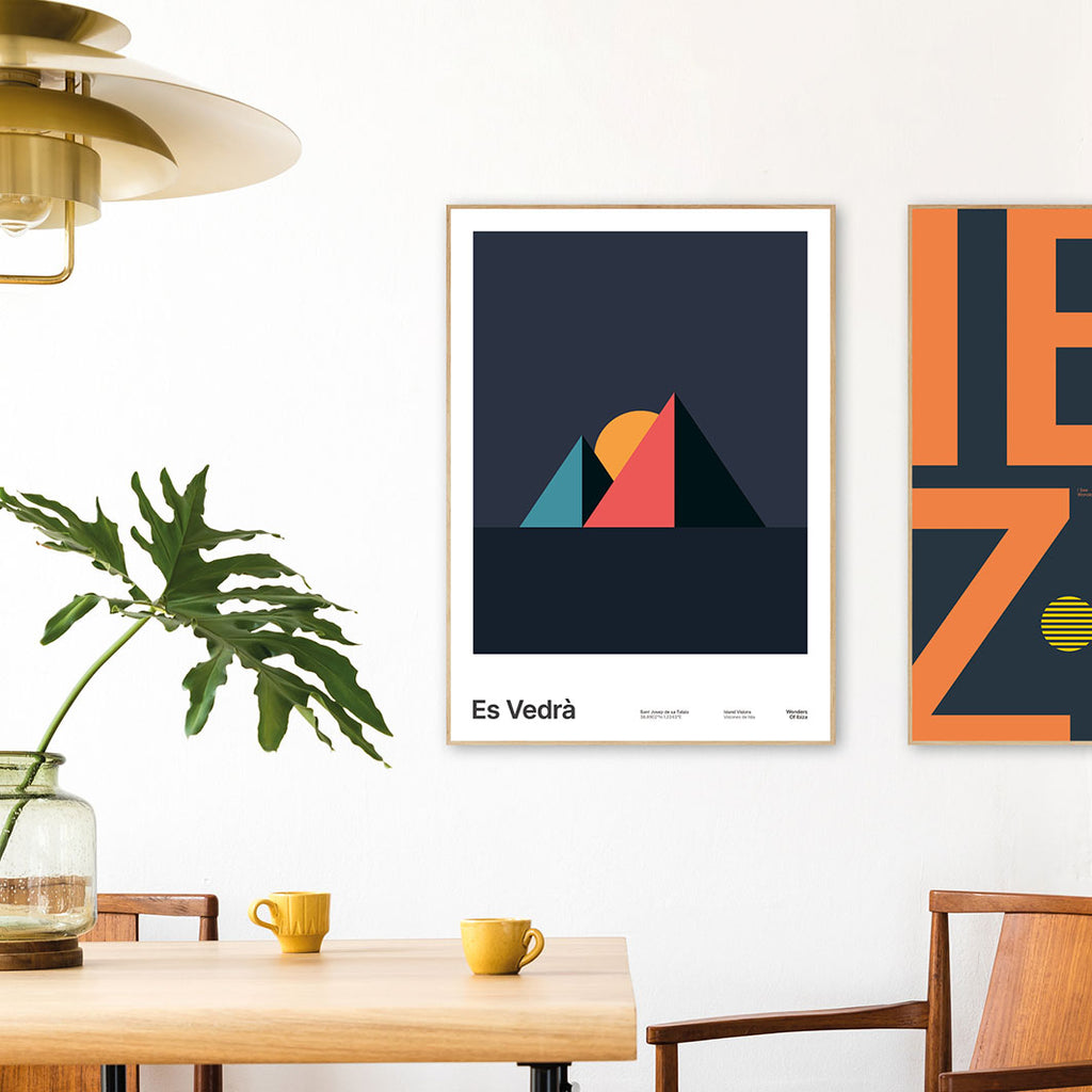 Framed Minimal style graphic design Ibiza art print of Es Vedra, Ibiza represented as pink pyramids on a night sky background