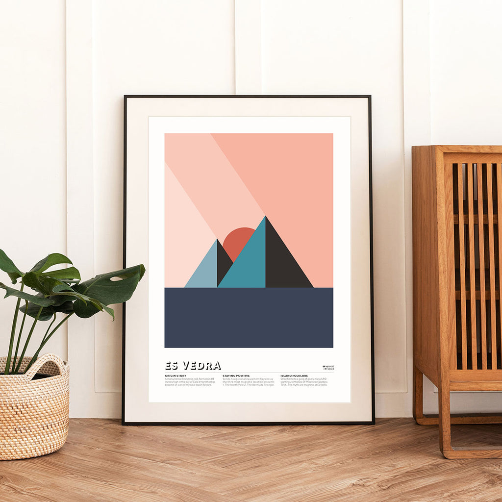 Framed Minimal style graphic design Ibiza art print of Es Vedra, Ibiza represented as pyramids plus a pink sky.