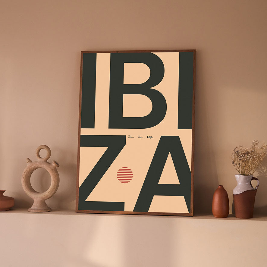 Framed Minimal style Ibiza typography print with the word Ibiza in a rich colour on a pastel, warm backdrop.