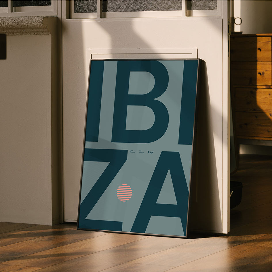 Framed Minimal style Ibiza typography print with the word Ibiza in a rich, dark navy on a grey/blue backdrop 