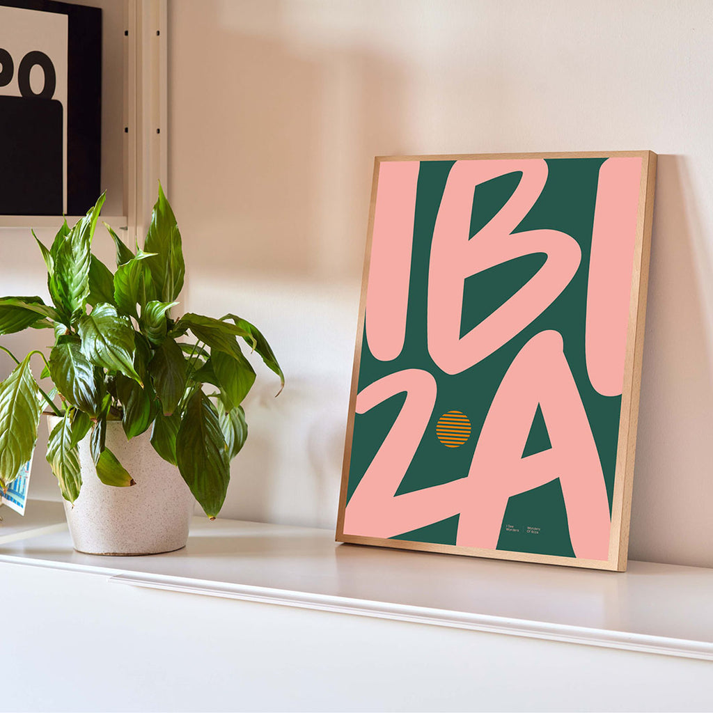 Framed Minimal style Ibiza typography print with the word Ibiza in golden peach and rich green colours.