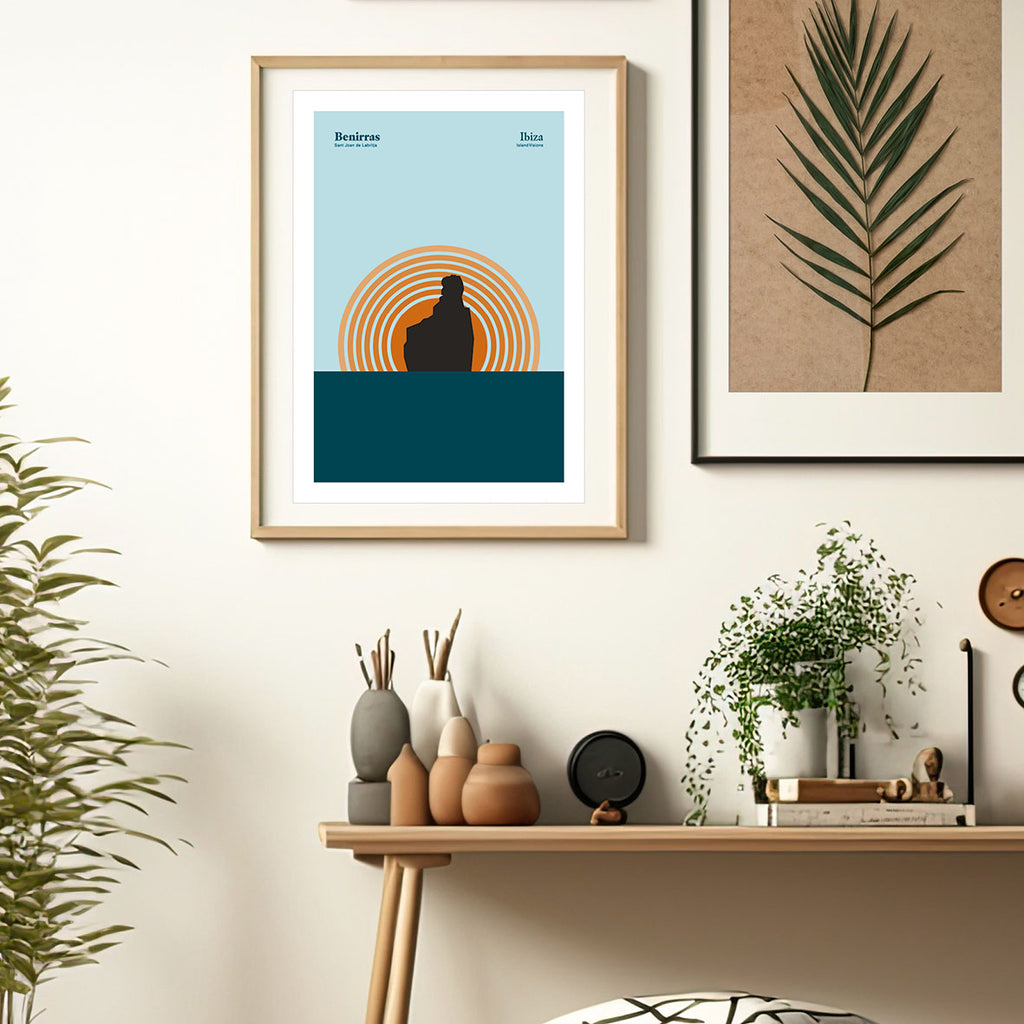 framed Minimal style graphic design Ibiza art print of the rock at Benirras Ibiza with the sun setting behind and blue sky.