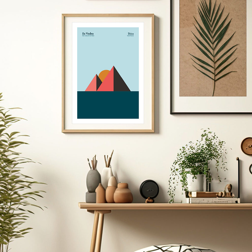 Framed Minimal style graphic design Ibiza art print of Es Vedra rocks represented as pyramids beneath a blue sky, Ibiza