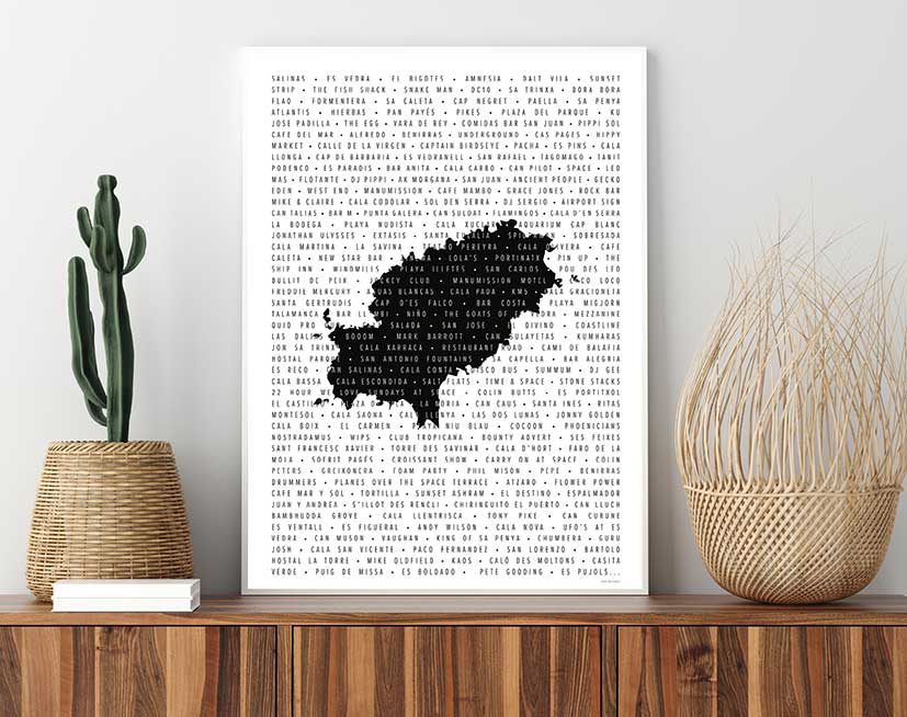 Framed print of list of special places in Ibiza over a watermark of the island from above