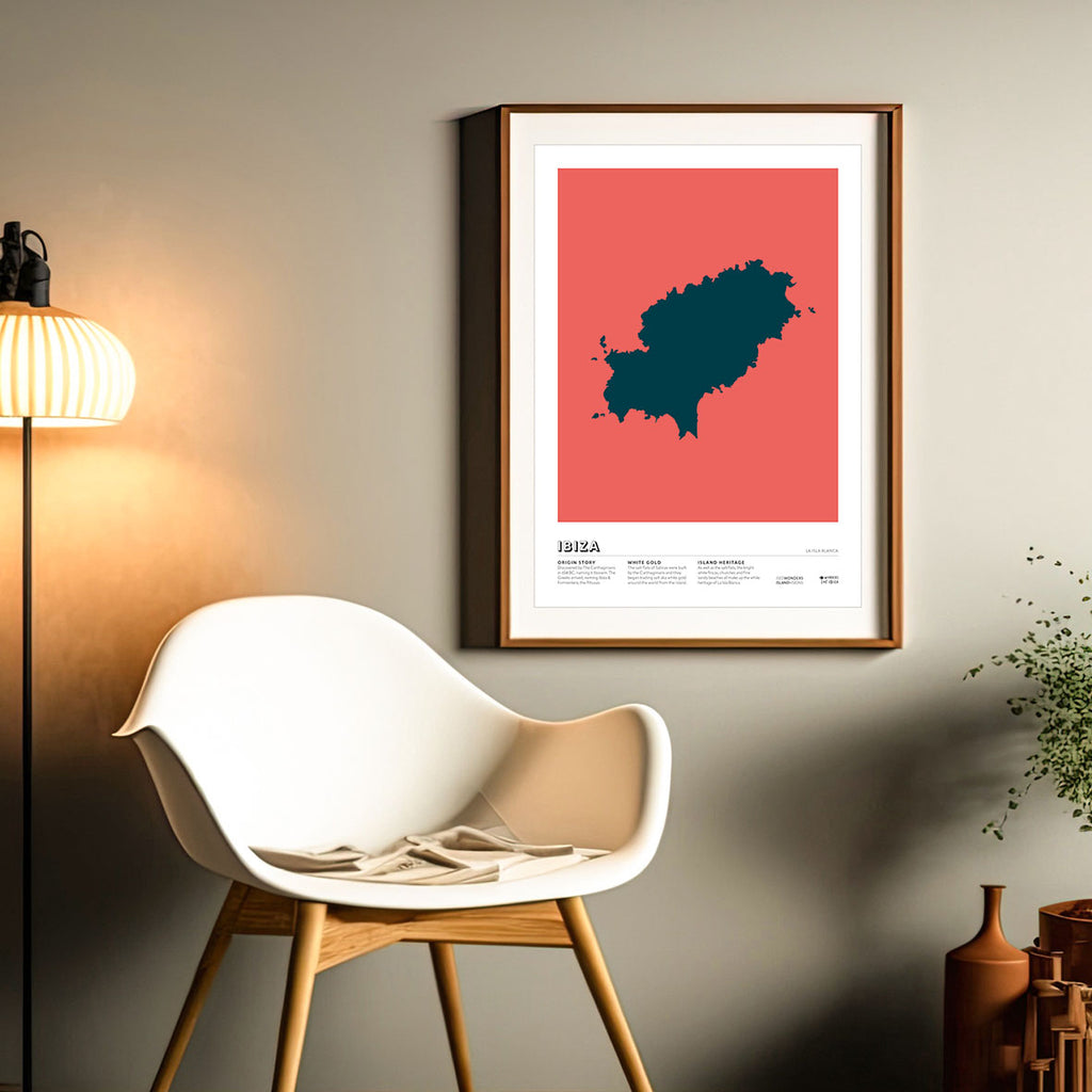 Framed Minimal style graphic design Ibiza art print of the island of Ibiza from above in dark blue with a pink red background.